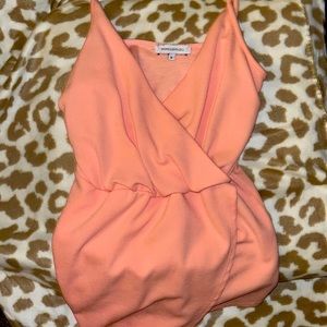 Peach colored Vanity Room romper size medium